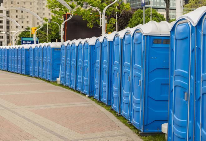 a line of portable restrooms at a sporting event, providing athletes and spectators with clean and accessible facilities in Brunswick, NC